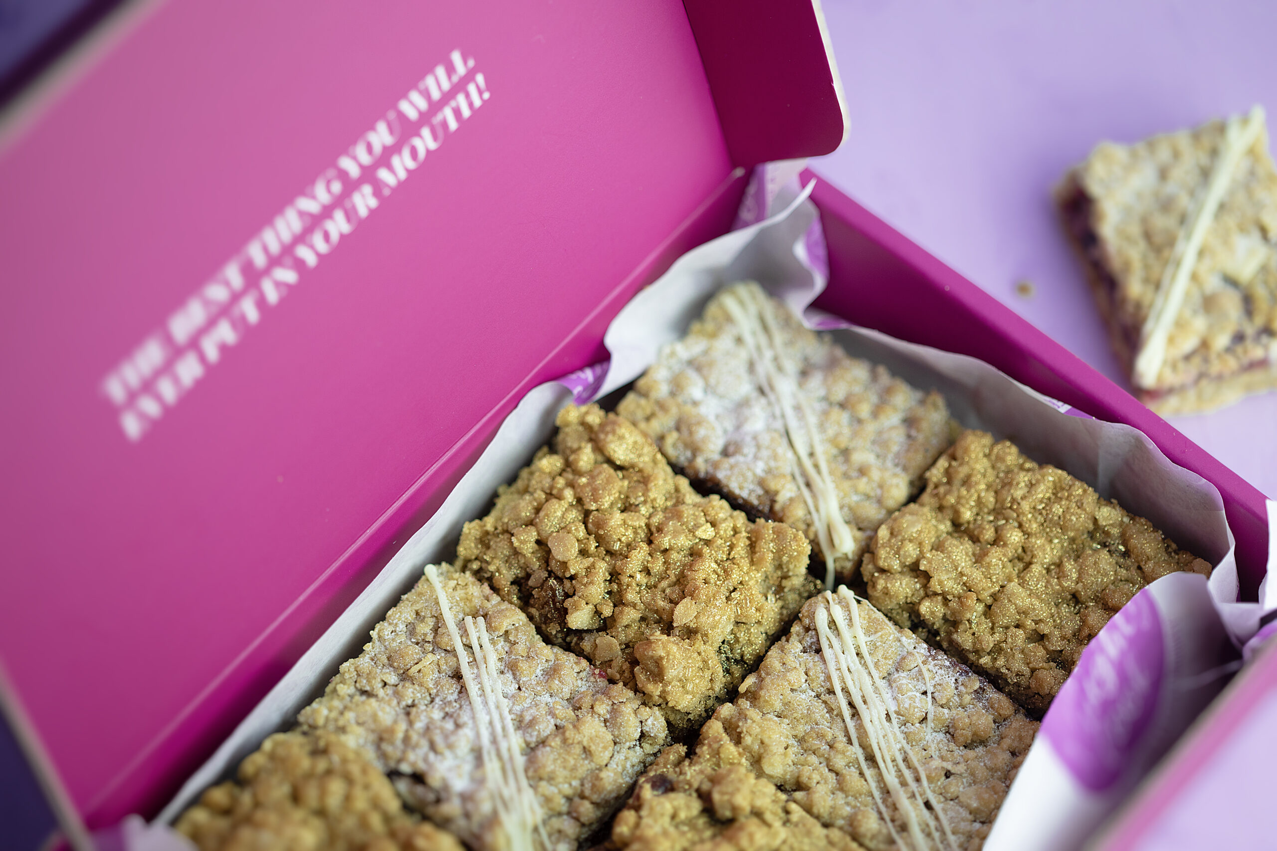 Close-up Festive Crumble Selection slice with rum mincemeat and cranberry white chocolate