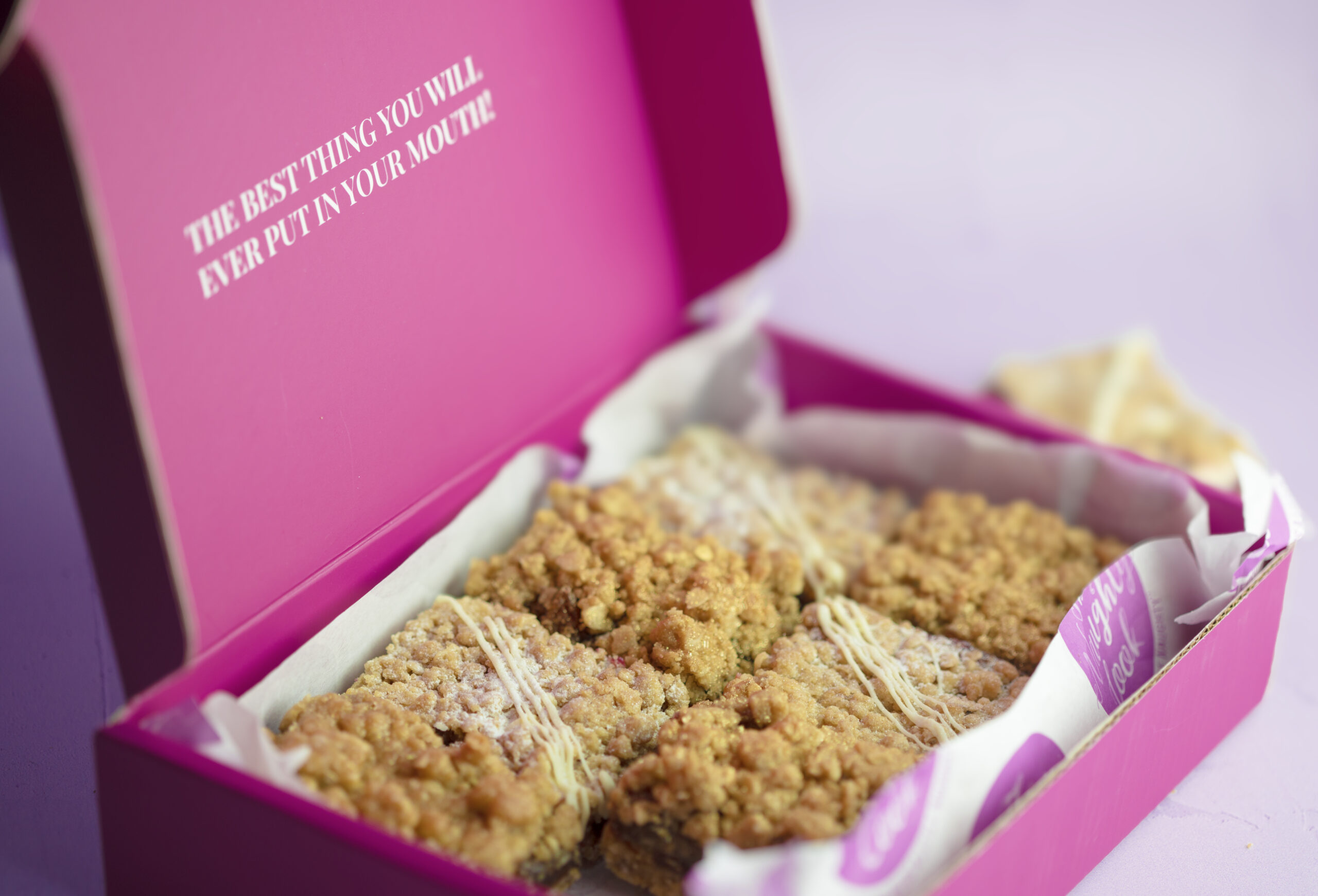 Close-up Festive Crumble Selection slice with rum mincemeat and cranberry white chocolate