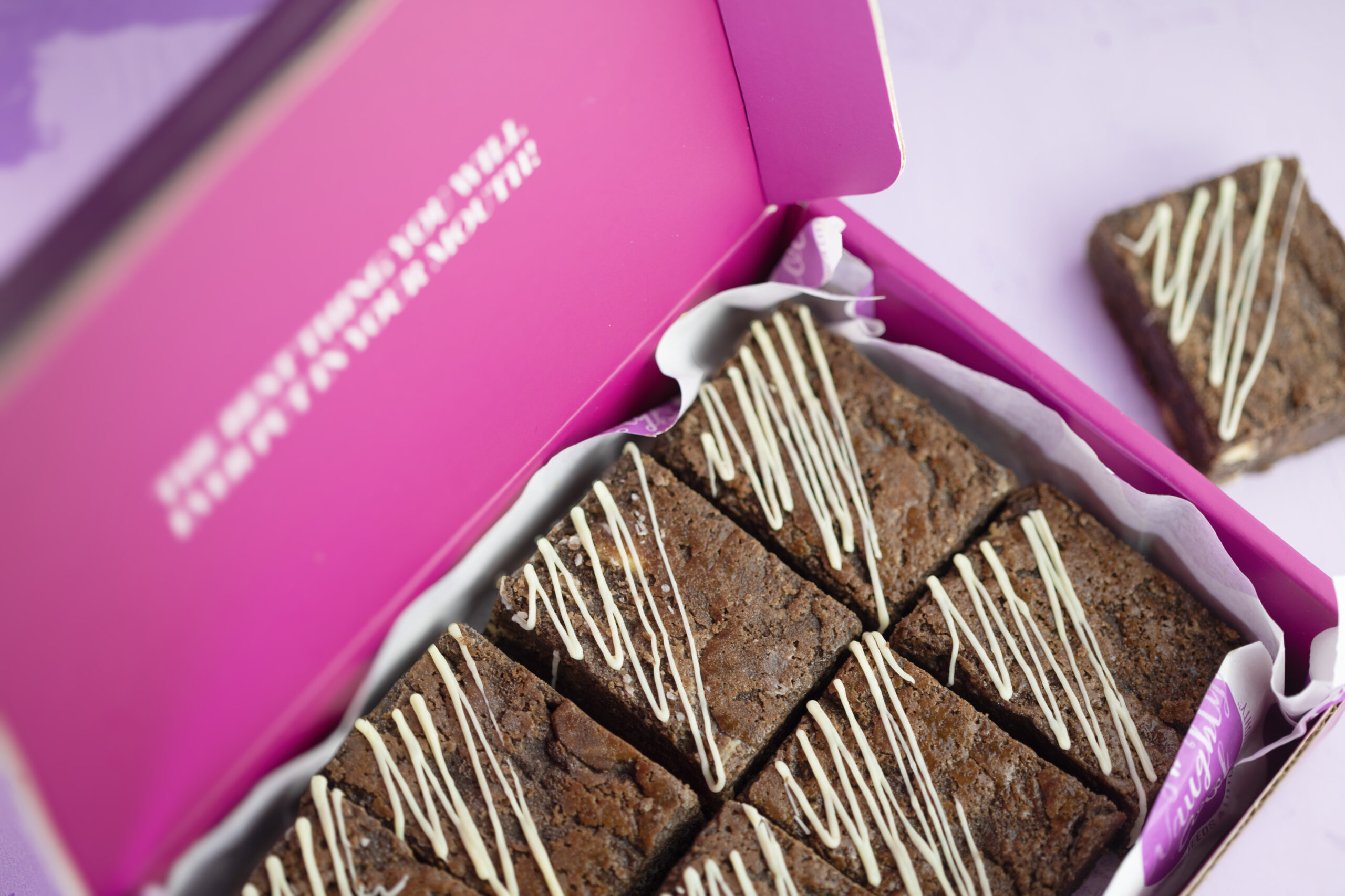 Close-up fudgy Triple Chocolate Brownies with caramelised Gold chocolate drizzle