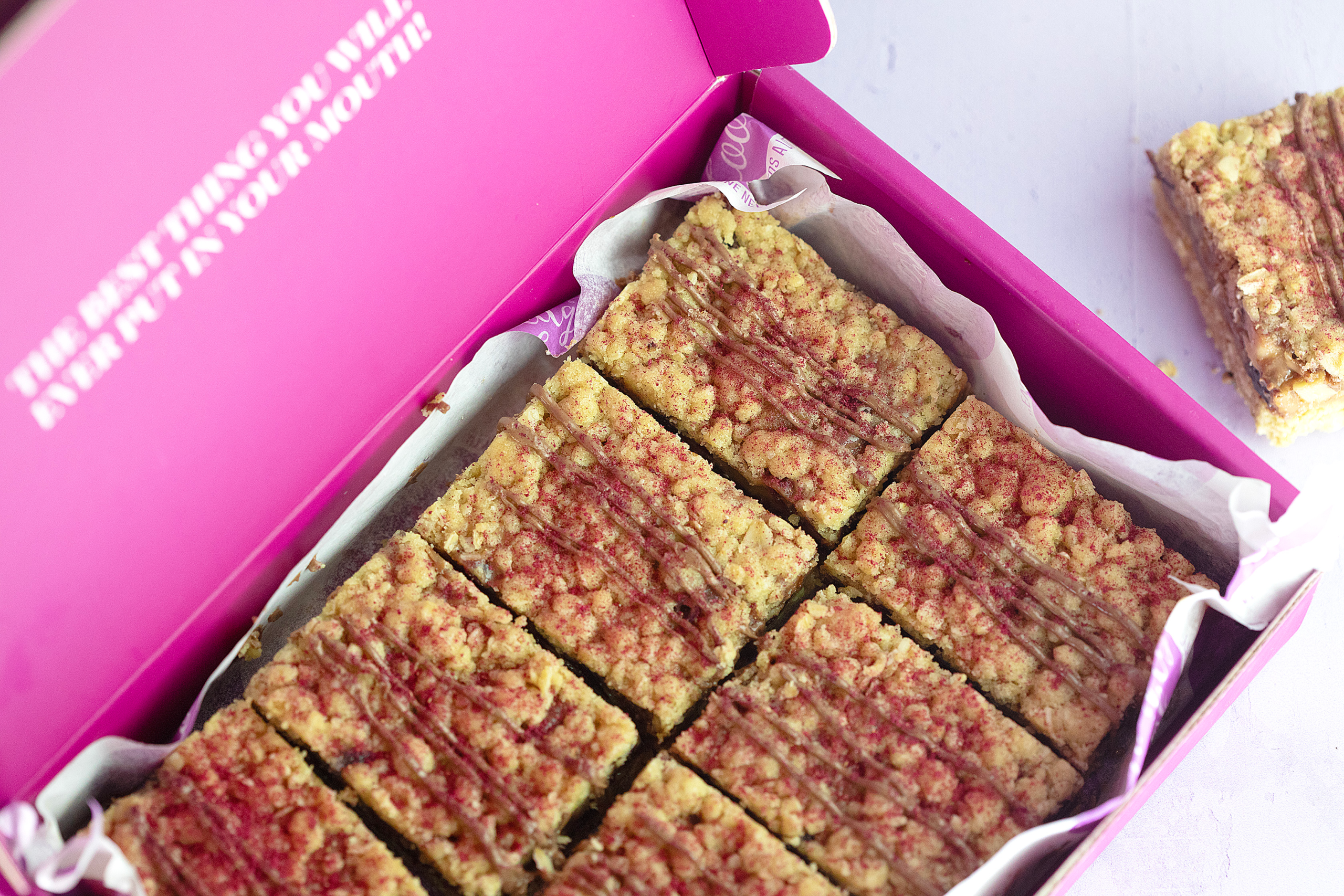 Fruit and nut crumbles in open box.